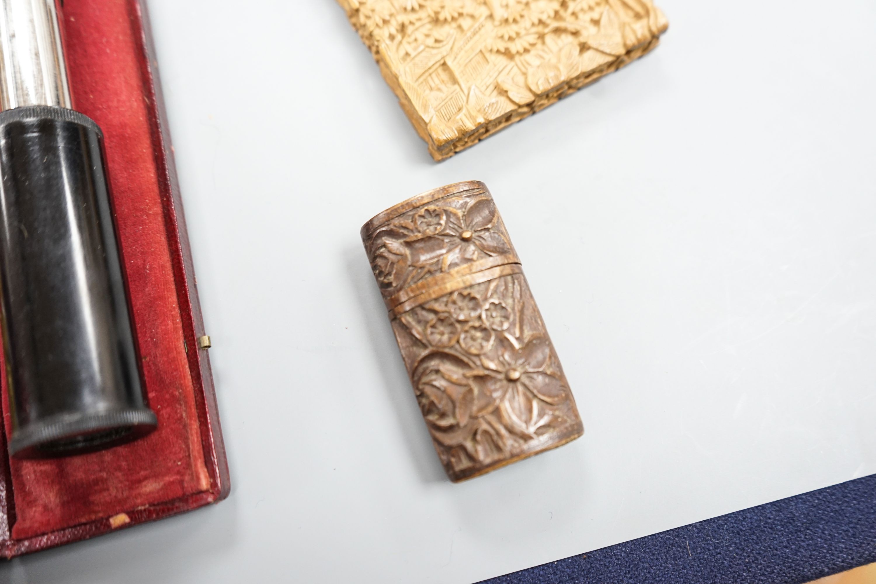 A Chinese carved sandalwood card case, a cased set of Avery gold scales, a Zonex telescope, a cased Cary prismatic instrument and a floral carved wood box.